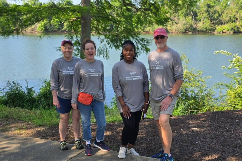 Central Savannah Chapter Hokies post in Run for Remembrance shirts in front of the river