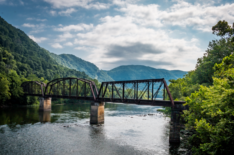 A scenic view of a bridge over a river in West Virginia